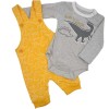 Conjunto overol amarillo dinosaurios.